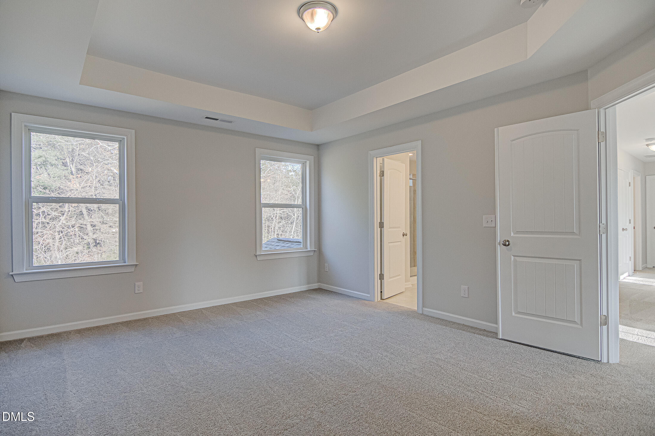 108 Starlet Ridge Way Clayton, NC 27520 - Photo 18 of 37 an empty room with windows and closet