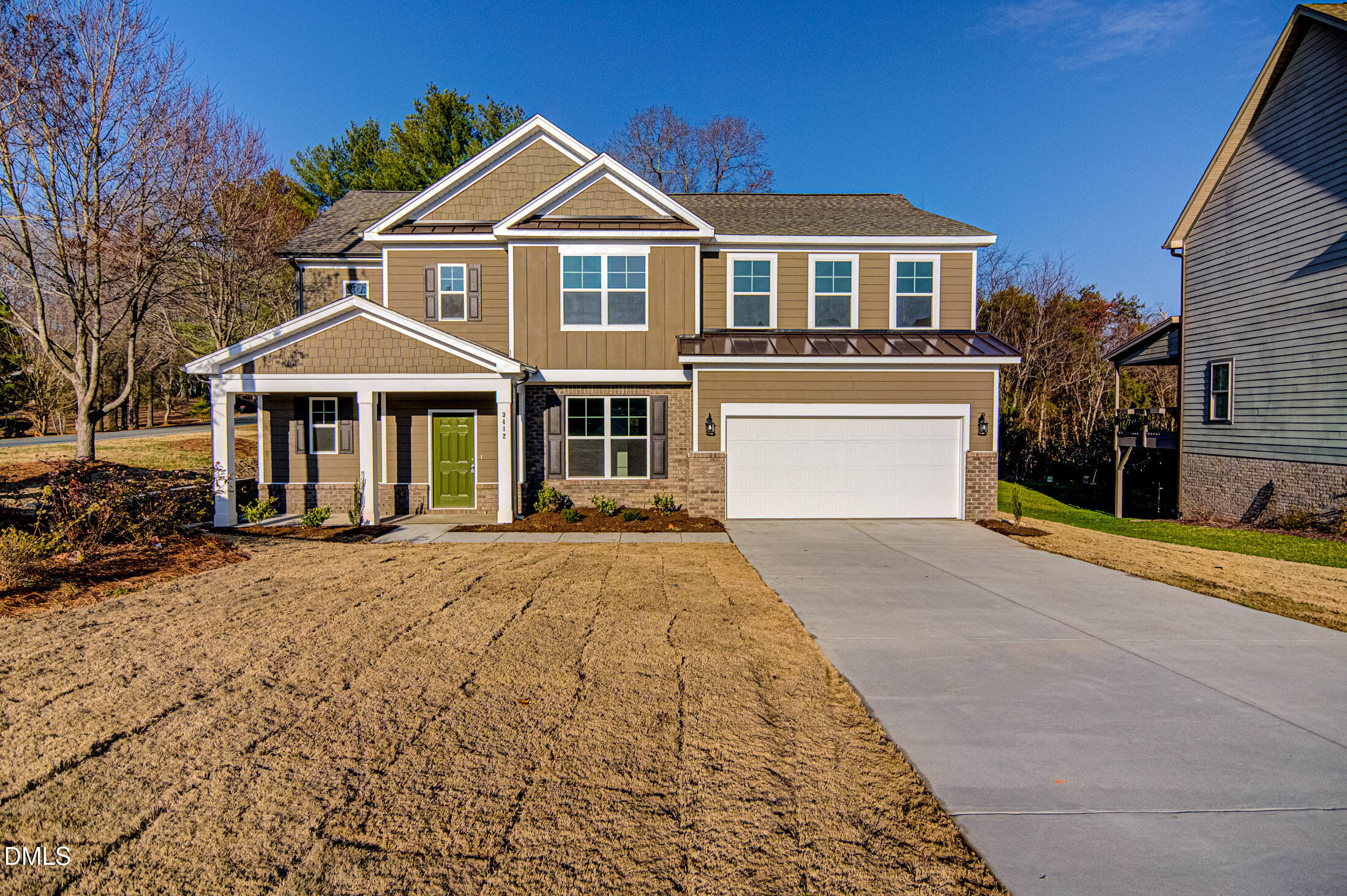 108 Starlet Ridge Way Clayton, NC 27520 - Photo 2 of 37 a front view of a house with a yard and garage
