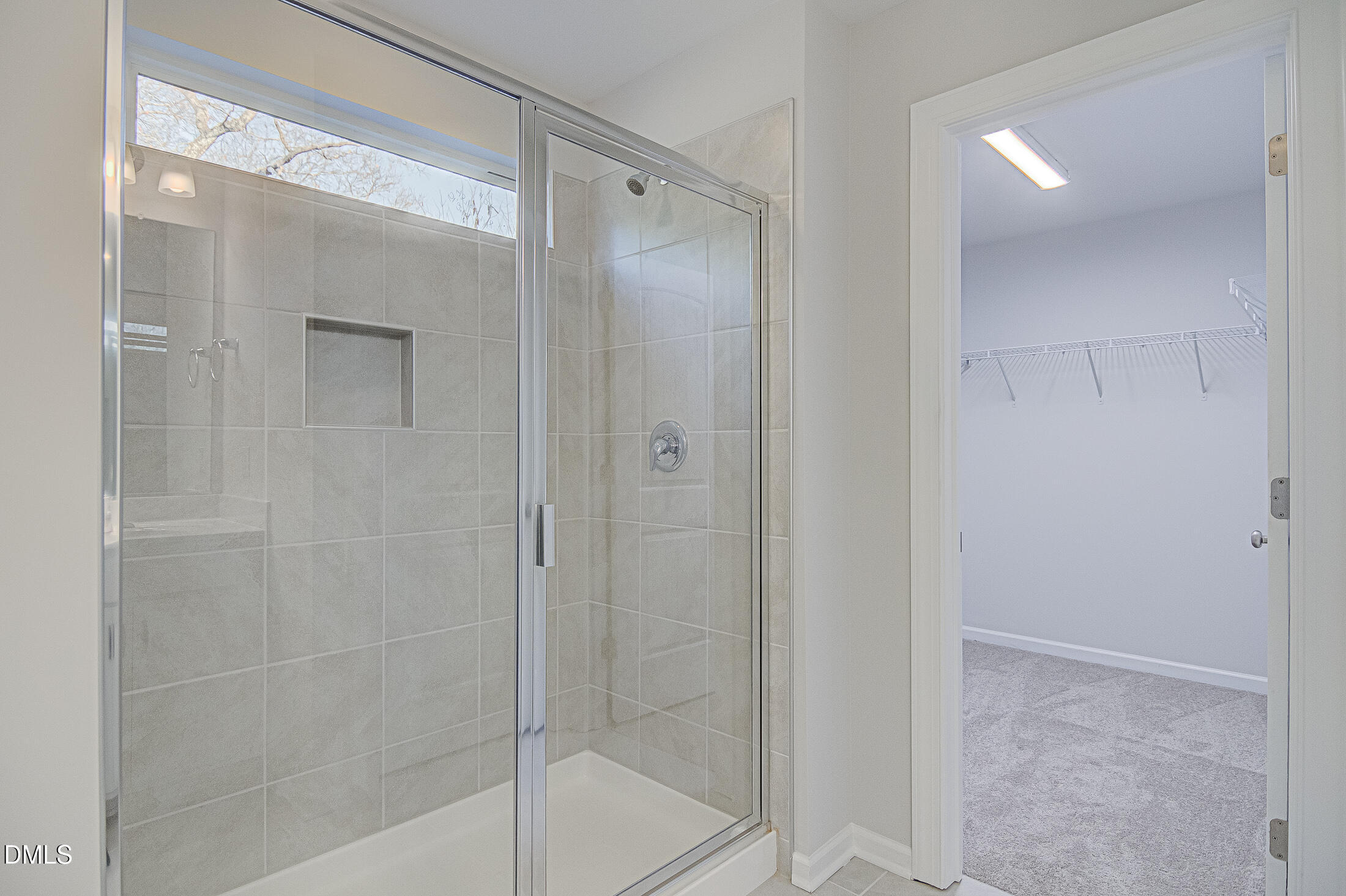 108 Starlet Ridge Way Clayton, NC 27520 - Photo 21 of 37 a bathroom with a glass shower door