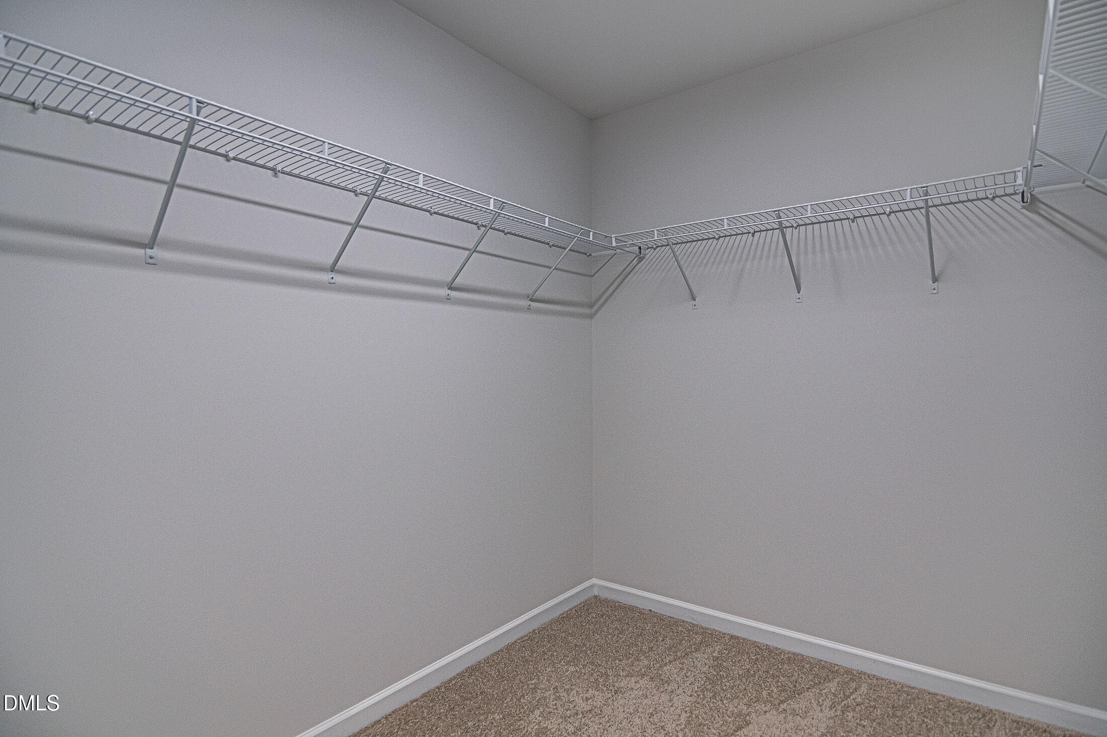 108 Starlet Ridge Way Clayton, NC 27520 - Photo 22 of 37 a view of a room with racks on the wall