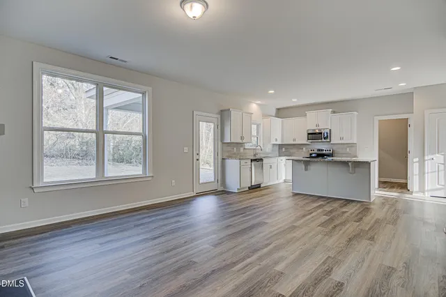 a view of kitchen with wooden floor