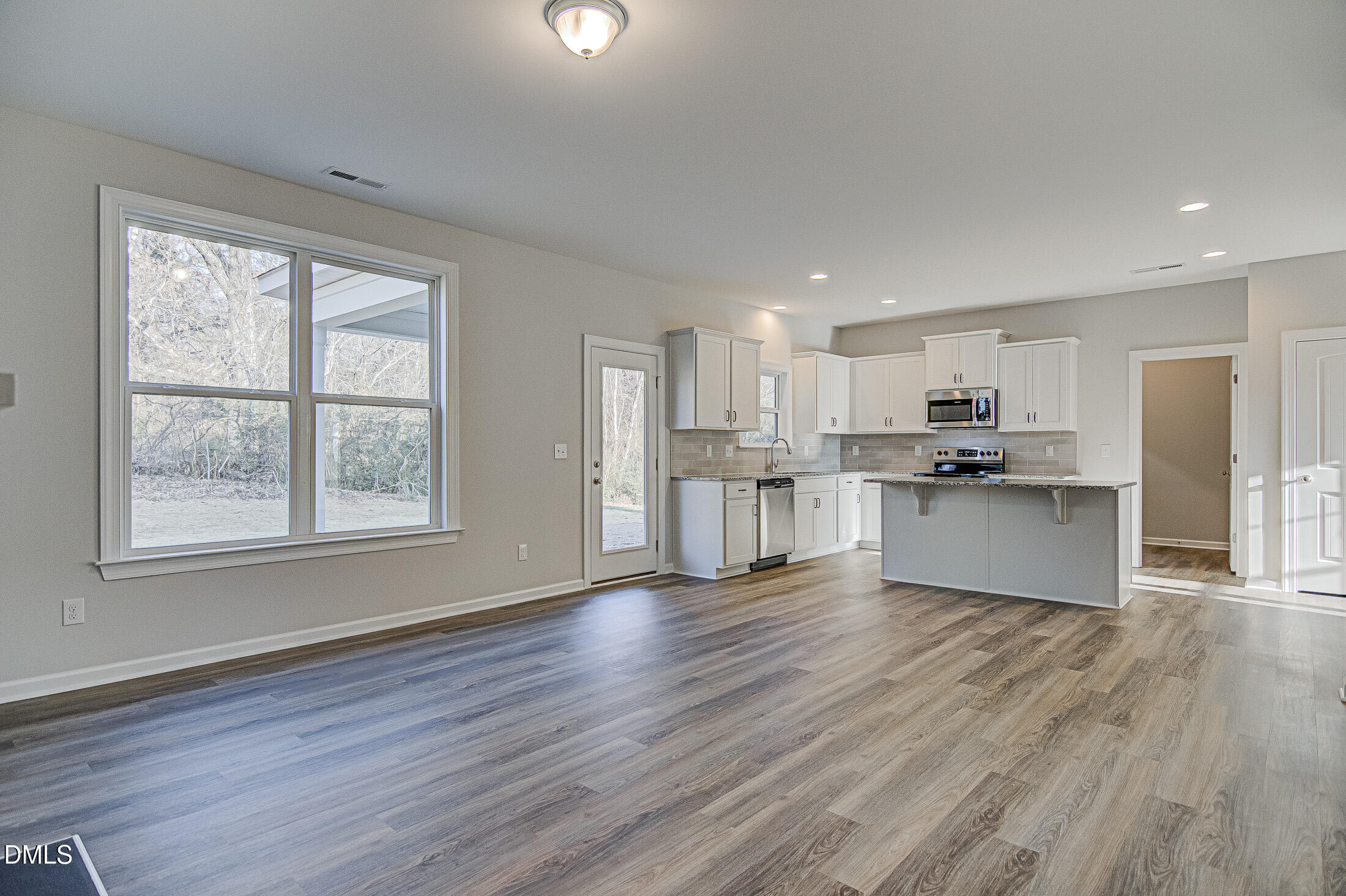 108 Starlet Ridge Way Clayton, NC 27520 - Photo 5 of 37 a view of kitchen with wooden floor