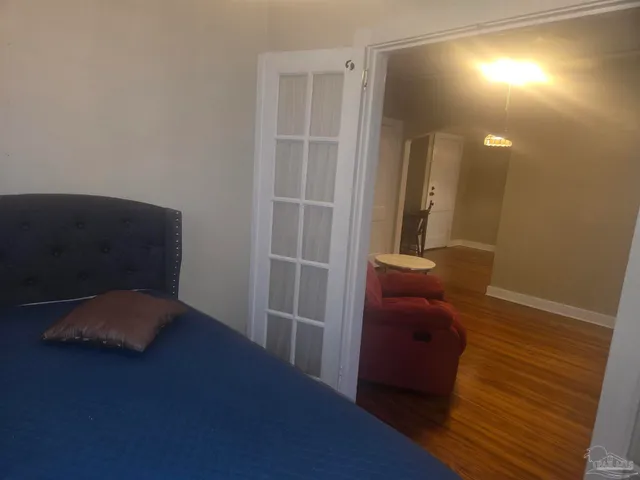 a view of hallway with wooden floor