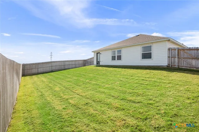 a view of a backyard with a garden