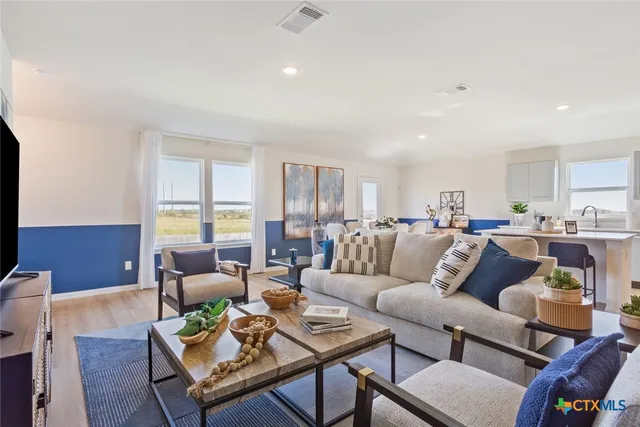 a living room with furniture and a table