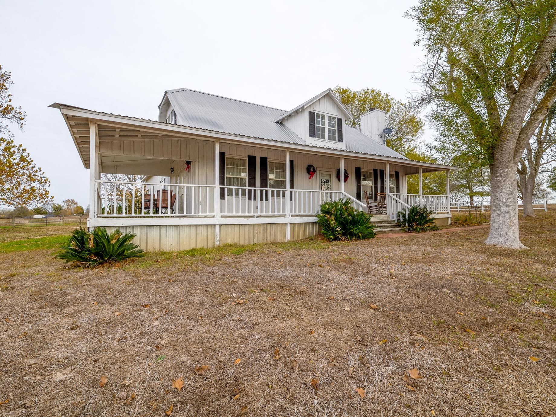 1505 Prairie Valley Road West Point, TX 78963 - Photo 24 of 34 a front view of a house with a yard and potted plants