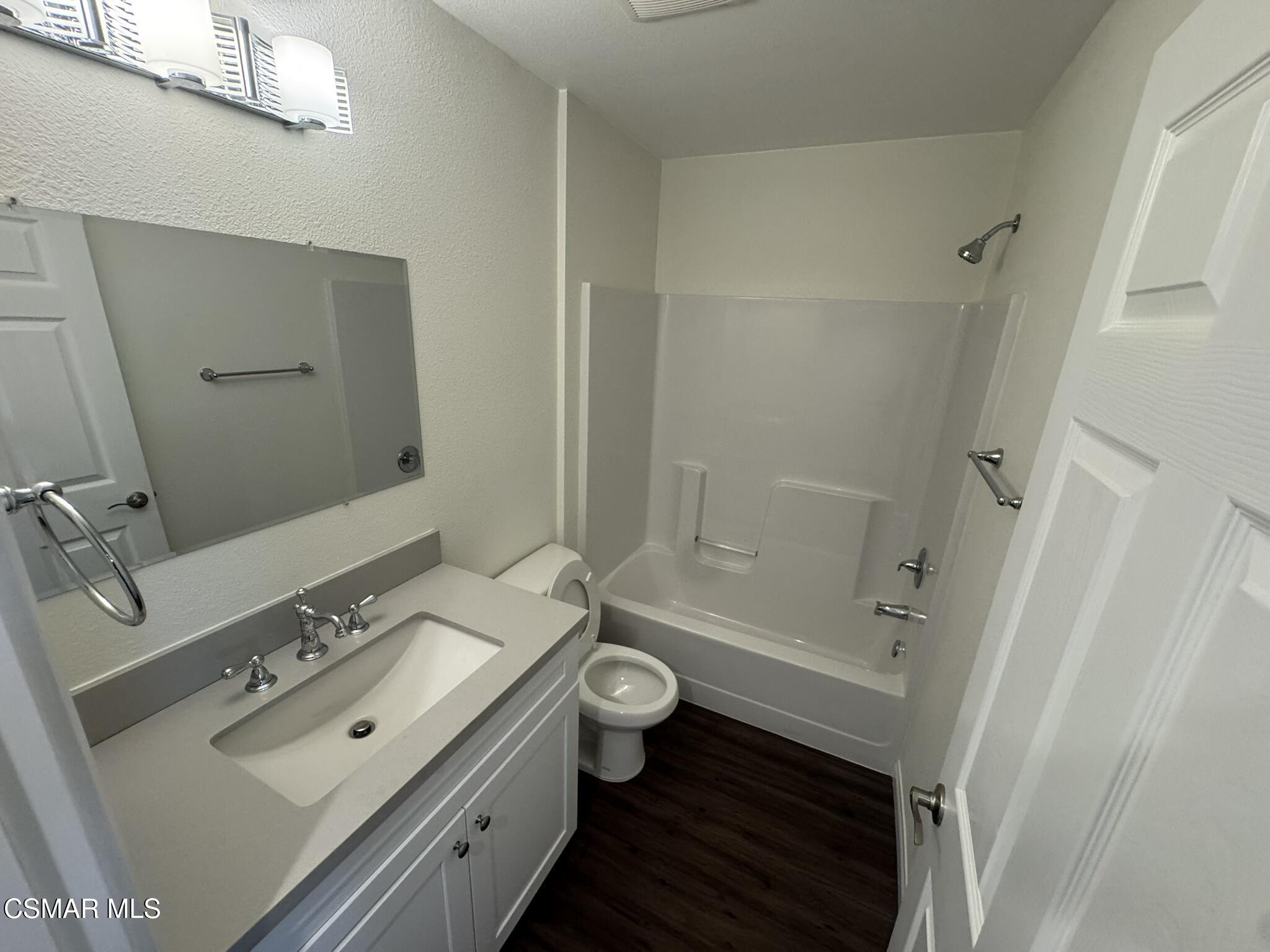 1850 Buyers Street, Unit 202 Simi Valley, CA 93063 - Photo 11 of 15 a bathroom with a double vanity sink toilet and shower