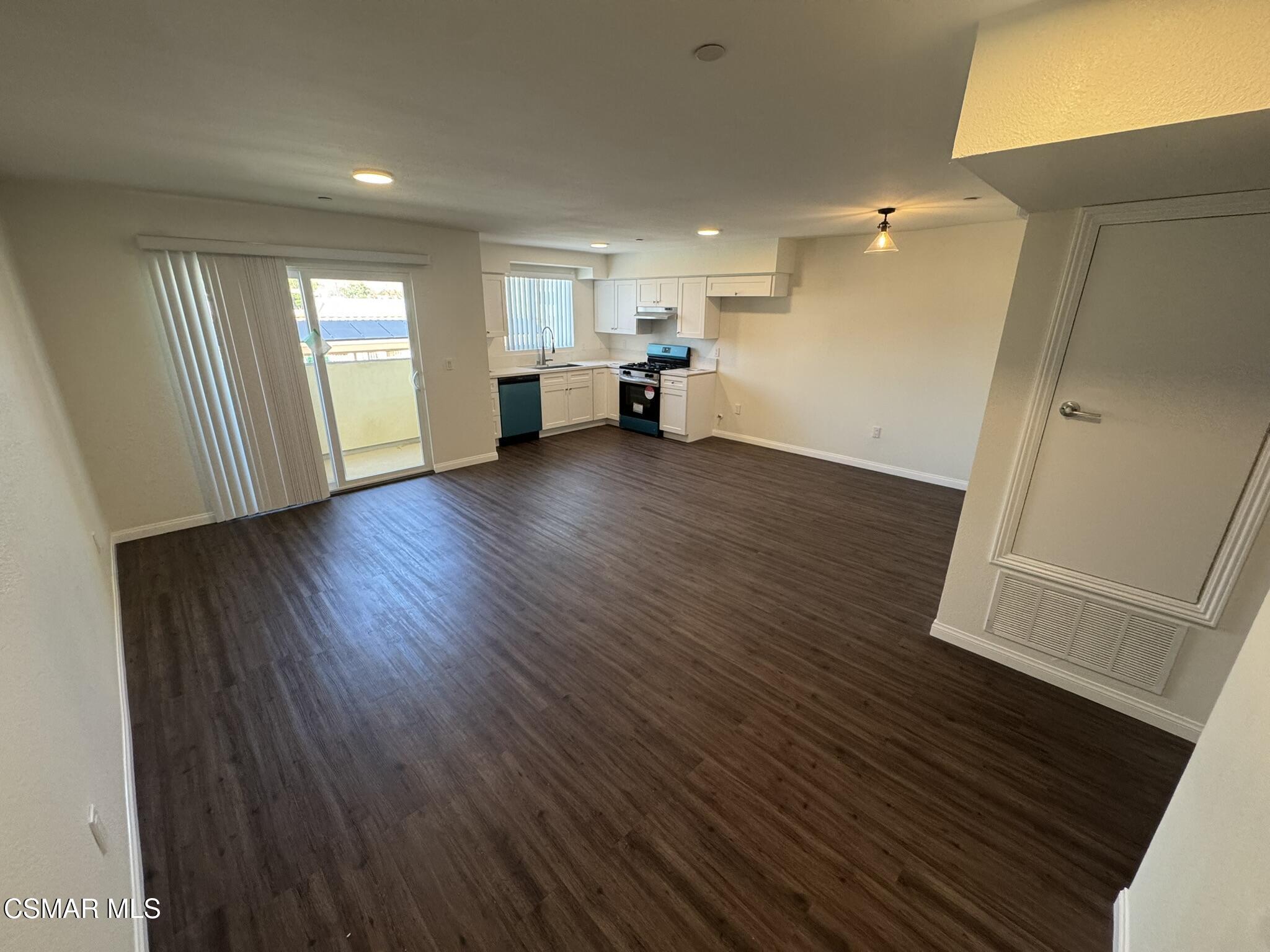 1850 Buyers Street, Unit 202 Simi Valley, CA 93063 - Photo 6 of 15 a view of empty room with wooden floor and window