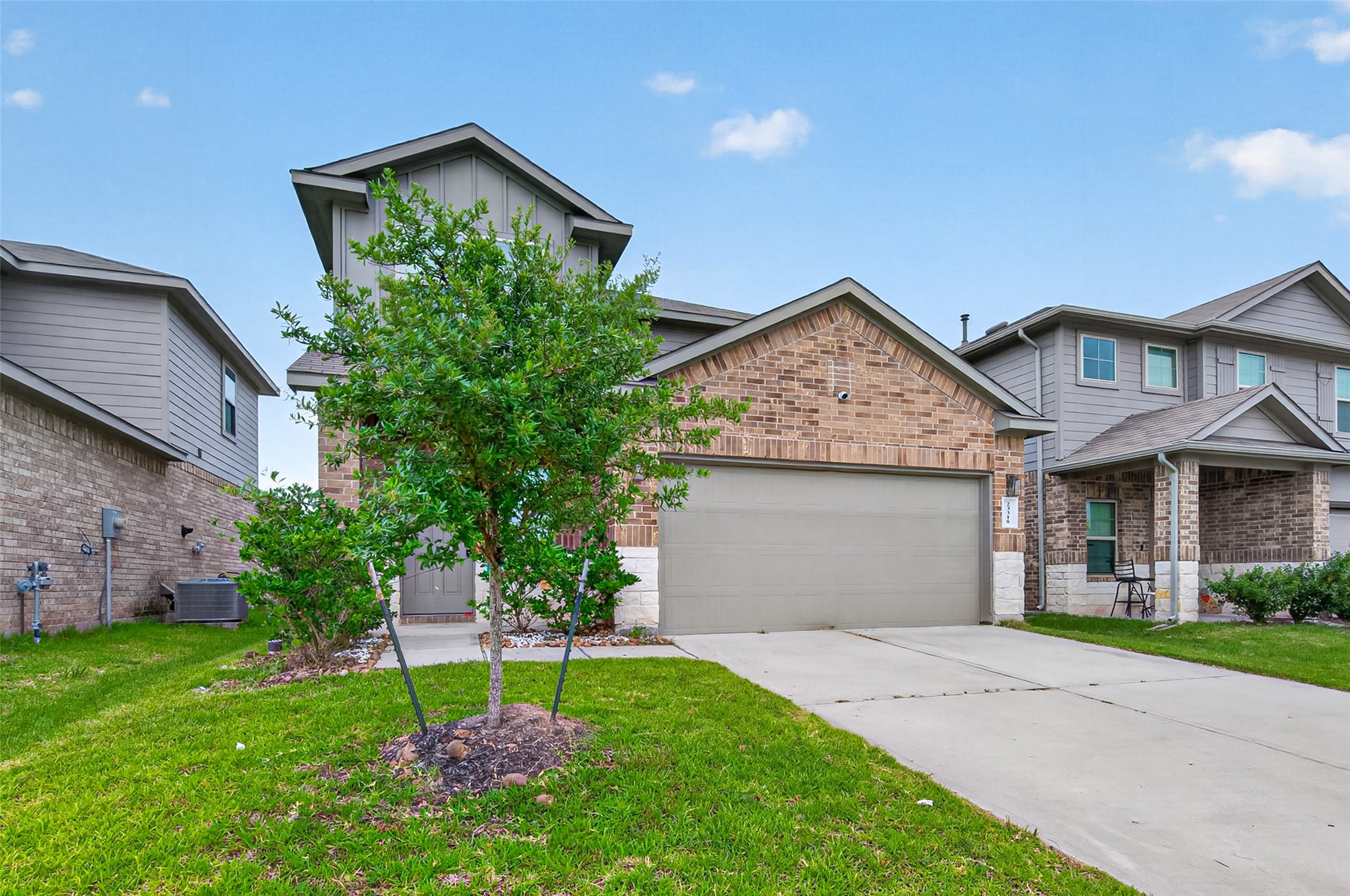 23318 Pelham Prairie Lane Spring, TX 77373 - Photo 2 of 50 a front view of a house with a yard and garage
