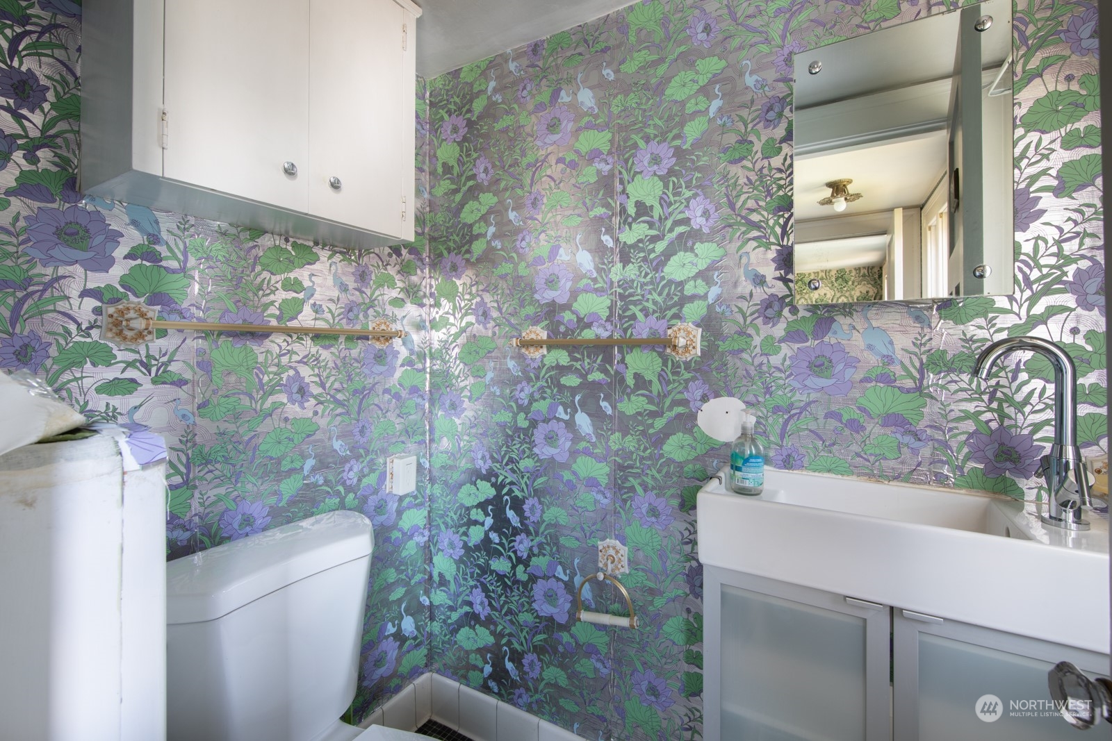2202 Rucker Avenue Everett, WA 98201 - Photo 13 of 37 a bathroom with a sink and mirror