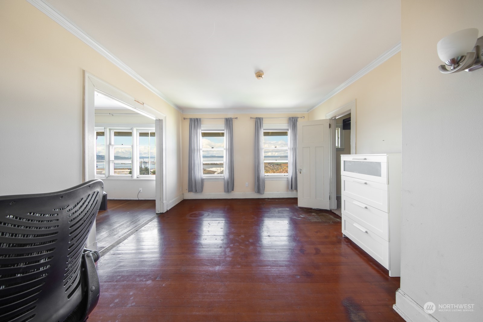 2202 Rucker Avenue Everett, WA 98201 - Photo 16 of 37 a view of an empty room with a window and wooden floor