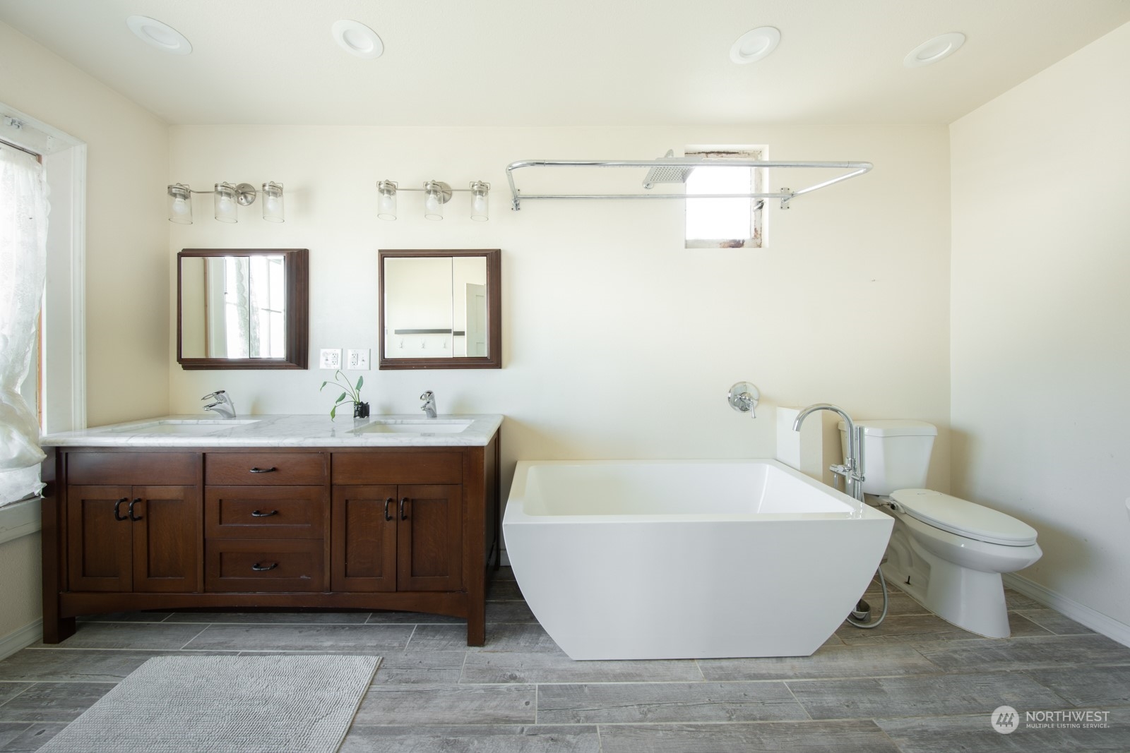 2202 Rucker Avenue Everett, WA 98201 - Photo 19 of 37 a bathroom with a granite countertop sink and a mirror