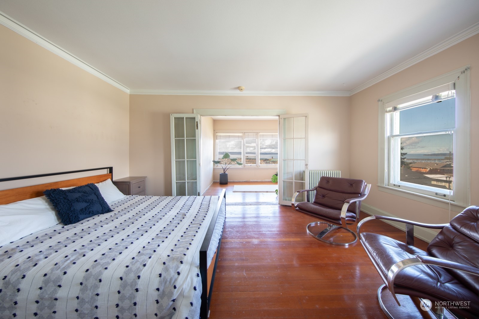 2202 Rucker Avenue Everett, WA 98201 - Photo 21 of 37 a bedroom with a bed and wooden floor