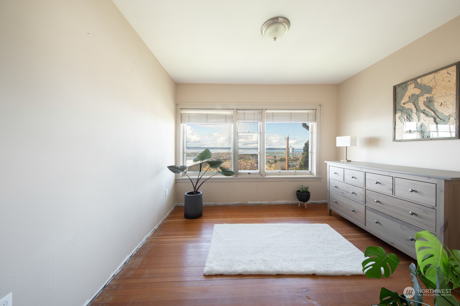2202 Rucker Avenue Everett, WA 98201 - Photo 23 of 37 a large white room with a large window and mirror