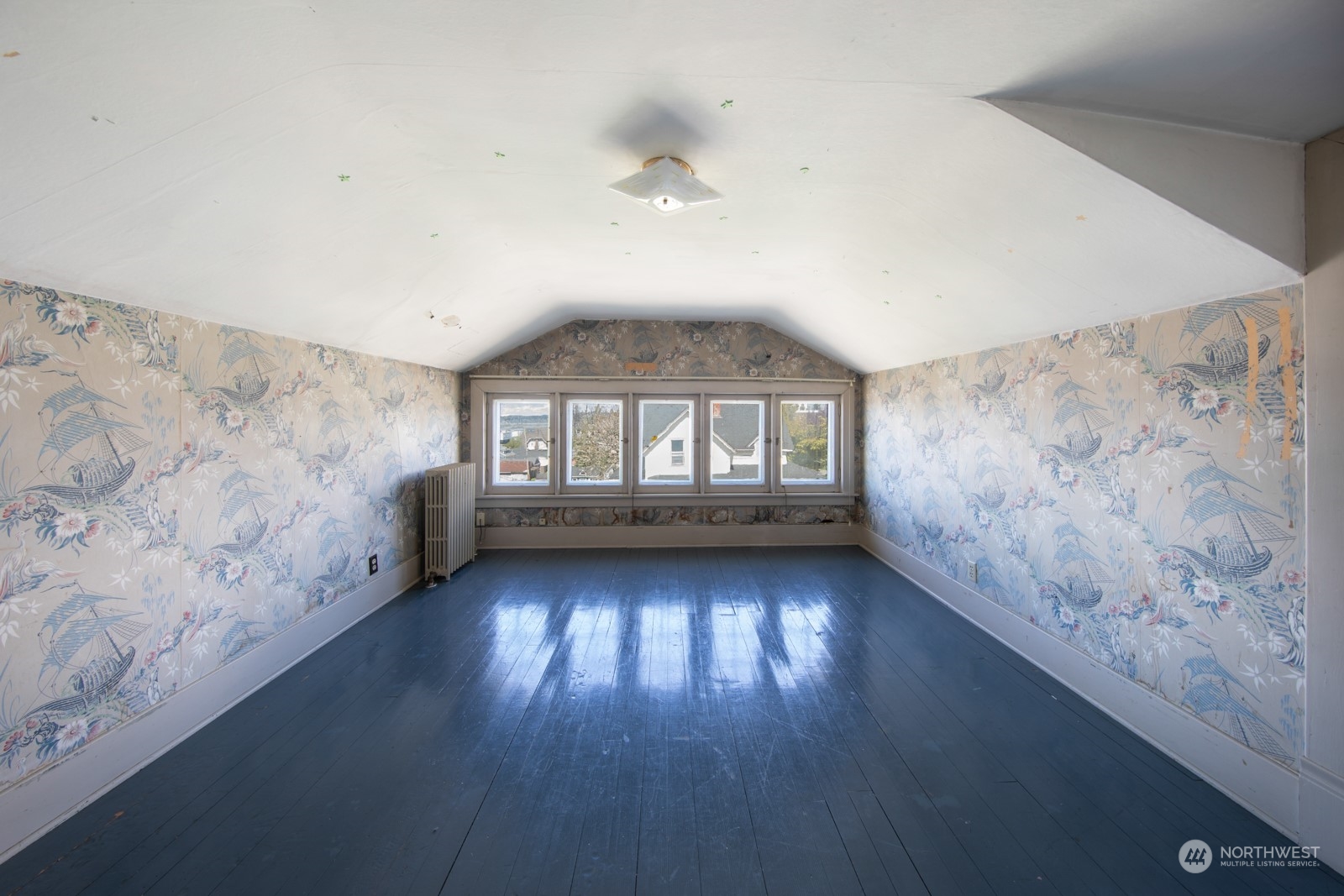 2202 Rucker Avenue Everett, WA 98201 - Photo 24 of 37 a view of an empty room with wooden floor and a window