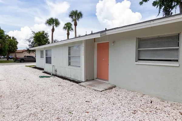 a view of backyard with small cabin