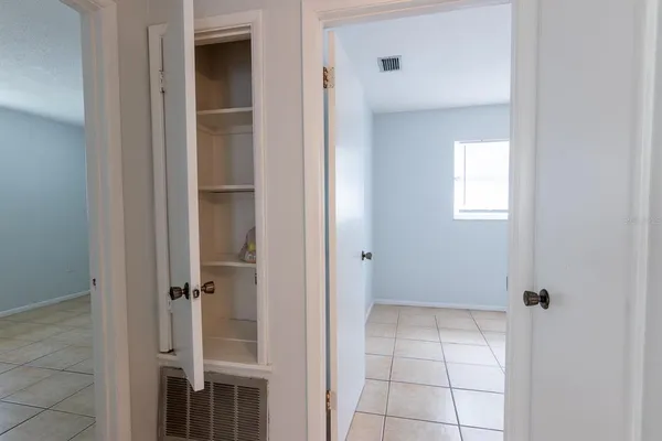 a view of an empty room with a window