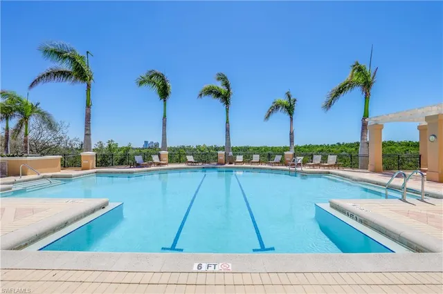 a view of swimming pool with outdoor seating and yard