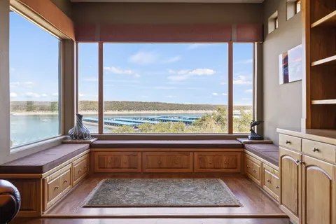 a view of a kitchen with a large window