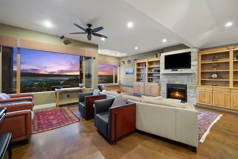a living room with furniture fireplace and flat screen tv