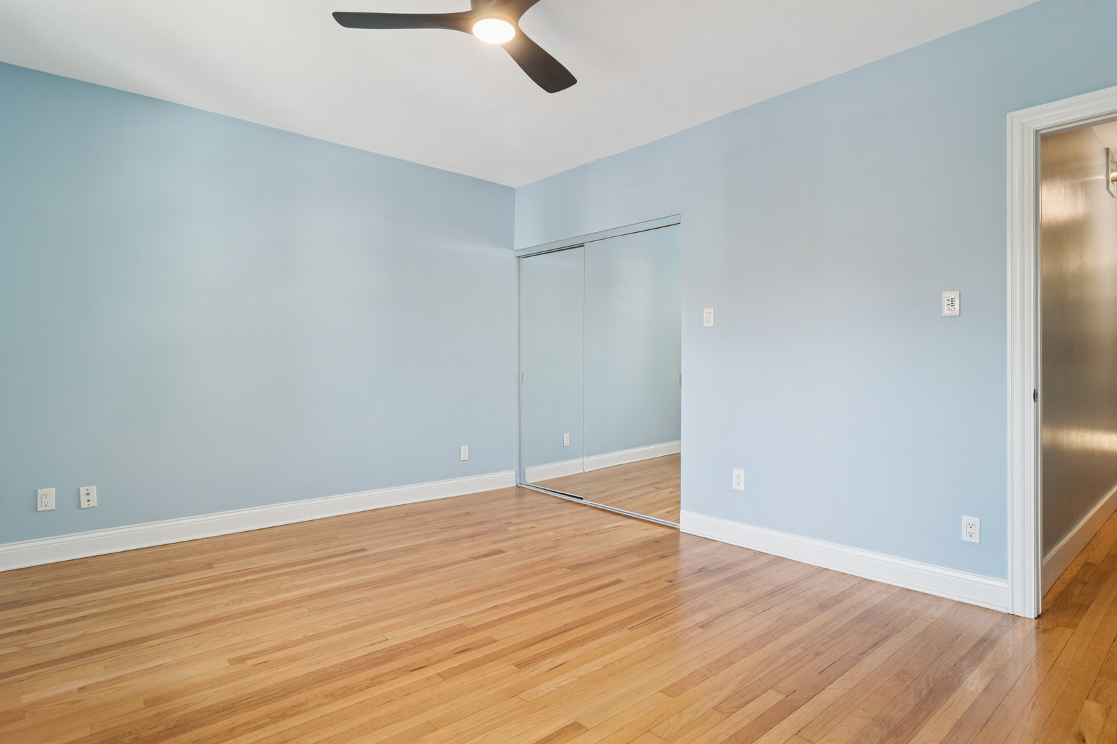 6232 North Broadway, Unit 2 Chicago, IL 60660 - Photo 14 of 22 wooden floor in an empty room