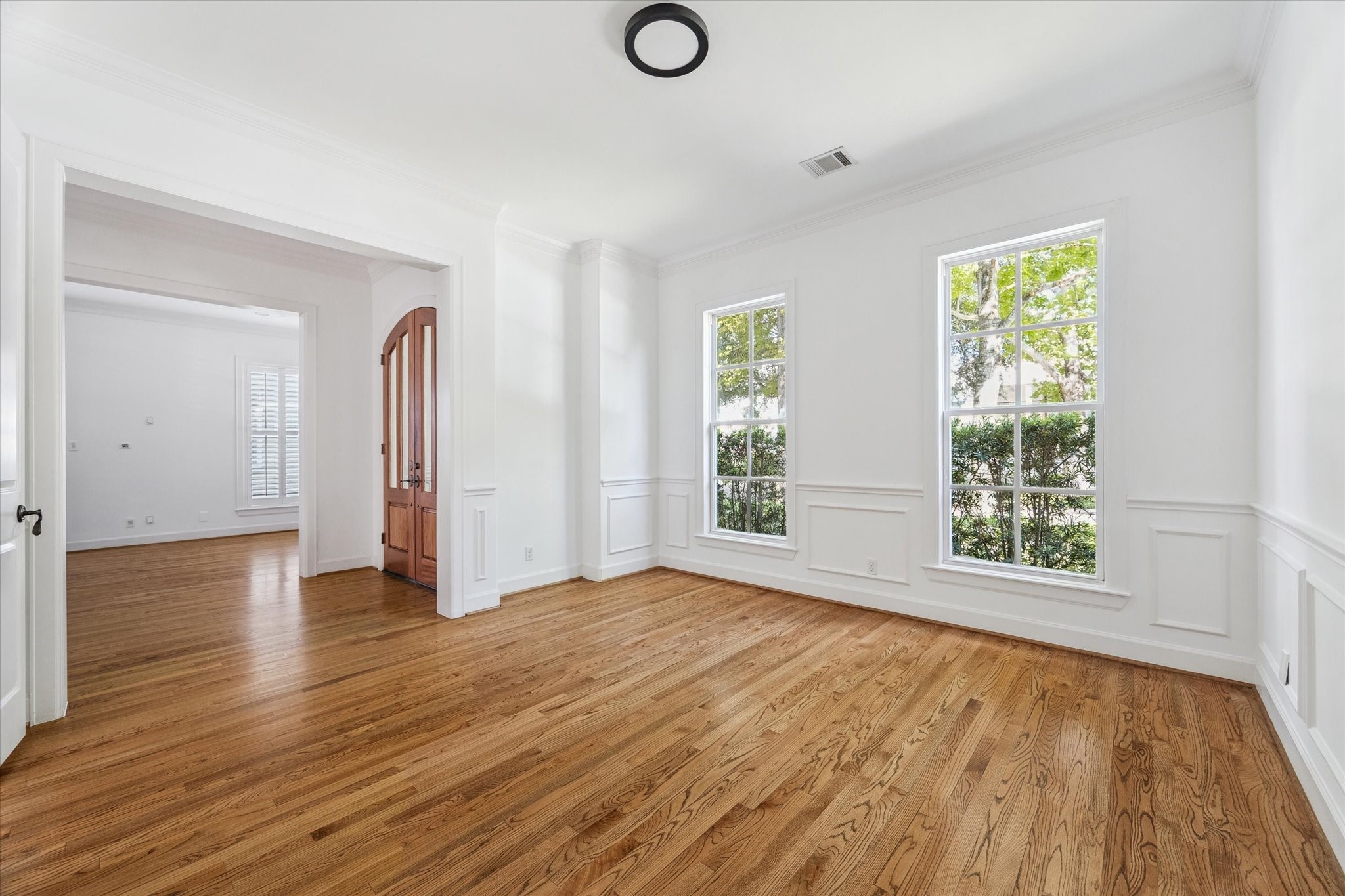 6106 Fordham Street Houston, TX 77005 - Photo 5 of 33 Another perspective of the dining space highlighting the flow to the entry hall and natural light from tall windows.