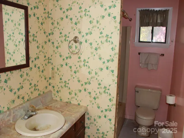 a view of cabinets a washer and dryer
