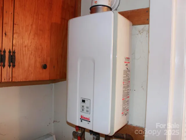 an entryway with wooden floor and cabinet