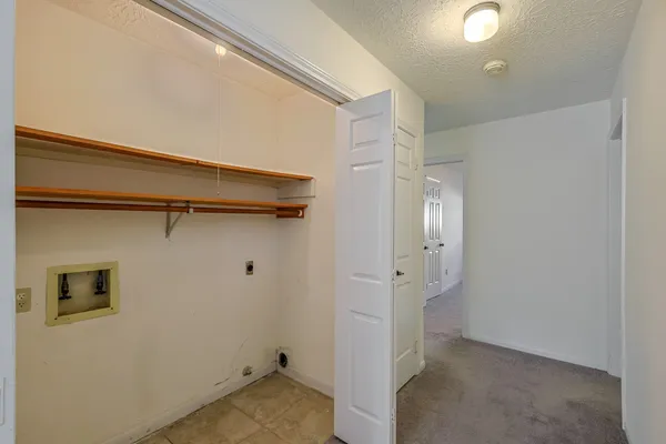 a view of a storage & utility room with closet