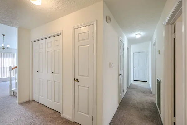 a view of a hallway with closet area