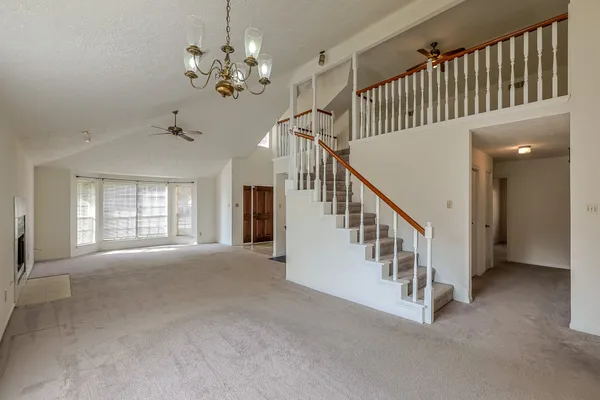 a view of staircase with wooden floor and staircase