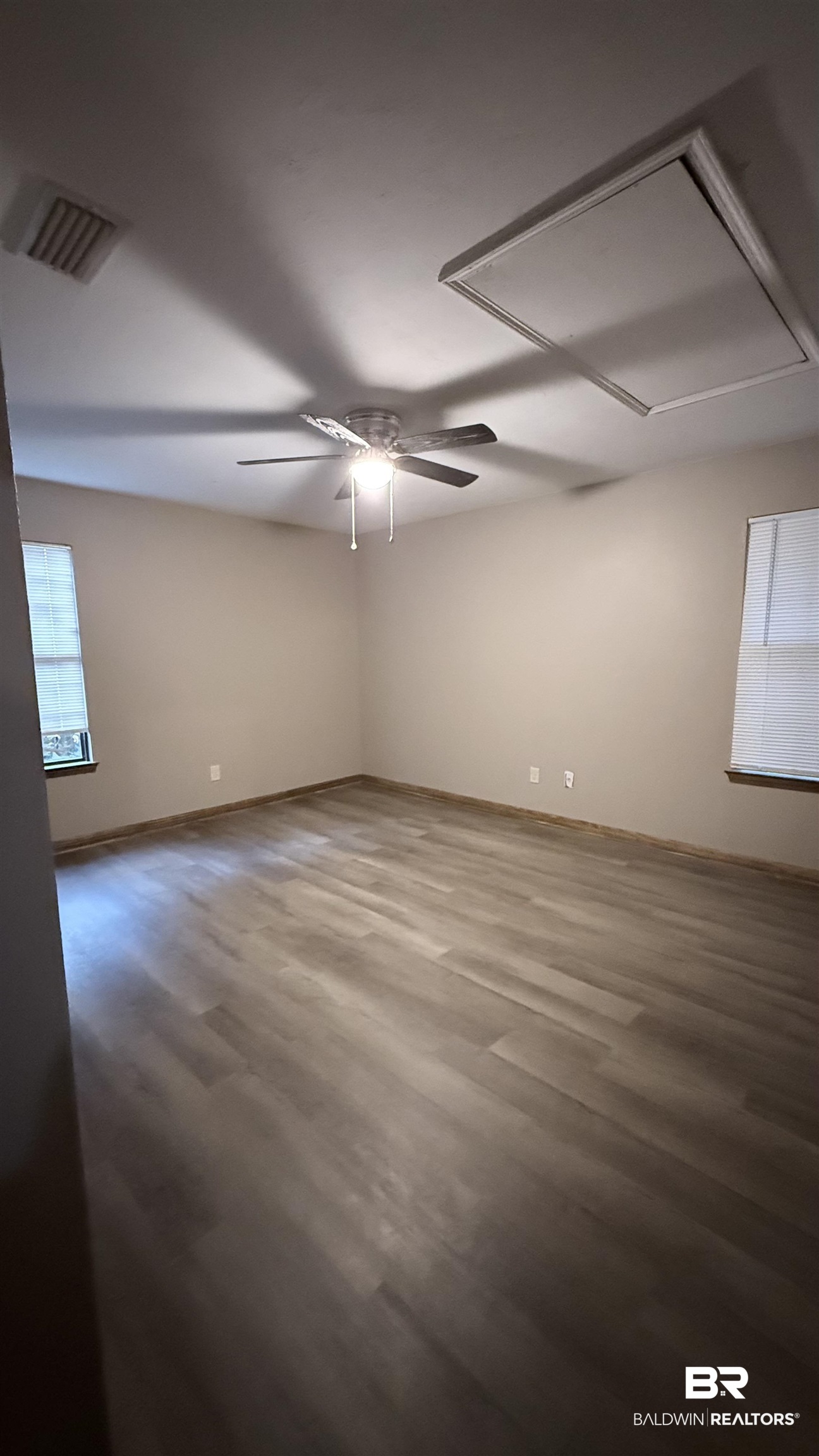 4131 Springdale Road Mobile, AL 36609 - Photo 12 of 28 Empty room featuring wood finished floors and ceiling fan