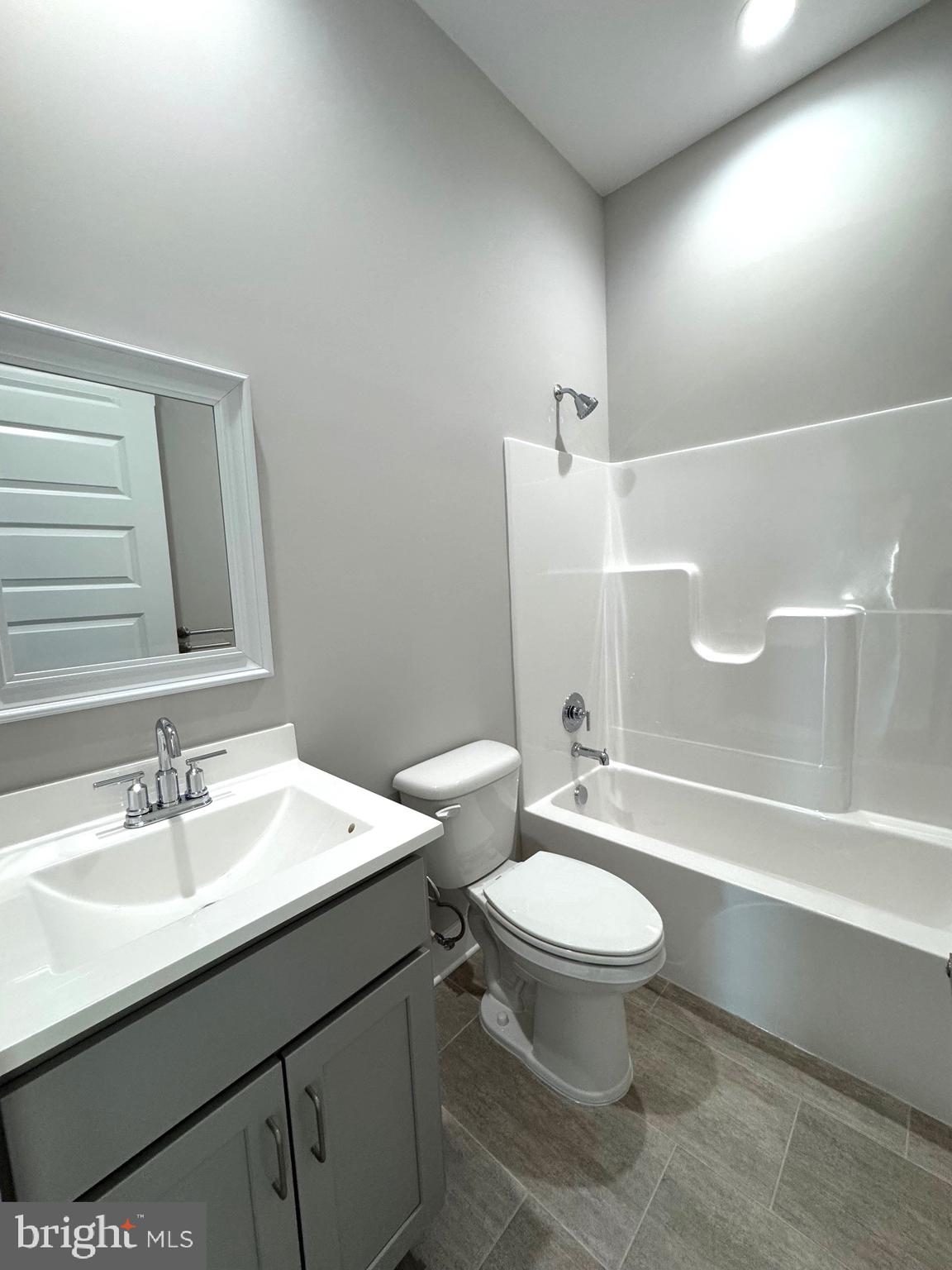8 Glenaire Road Bunker Hill, WV 25413 - Photo 10 of 17 a bathroom with a sink toilet and a mirror