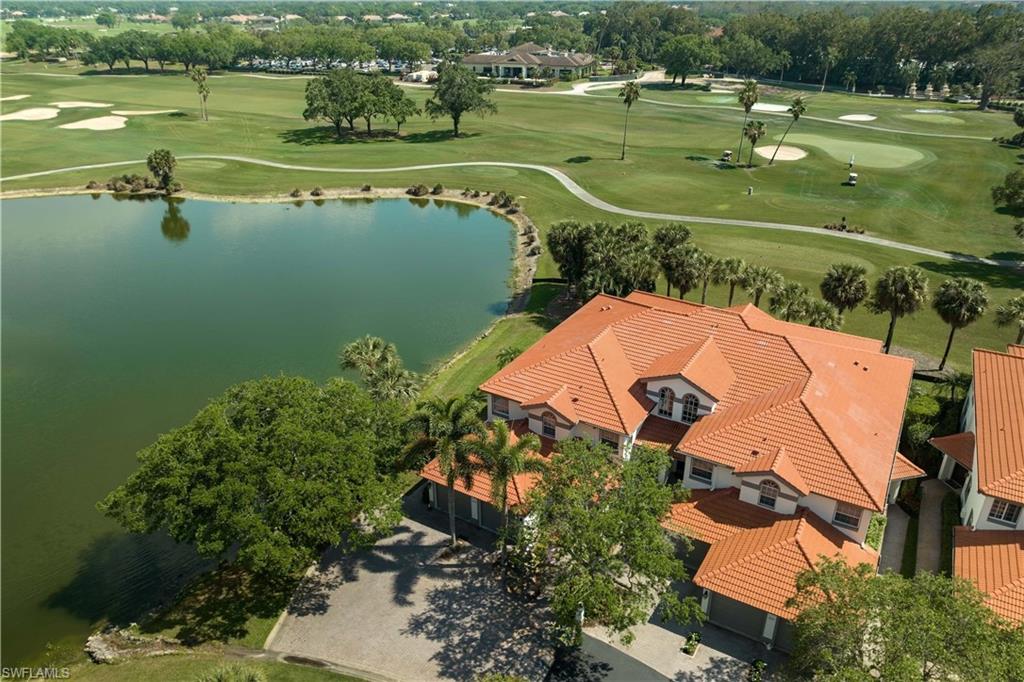 an aerial view of a house with a lake view