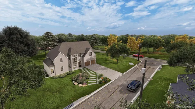 an aerial view of a house with garden space and street view