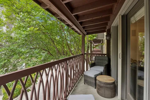 a view of house with backyard and wooden fence