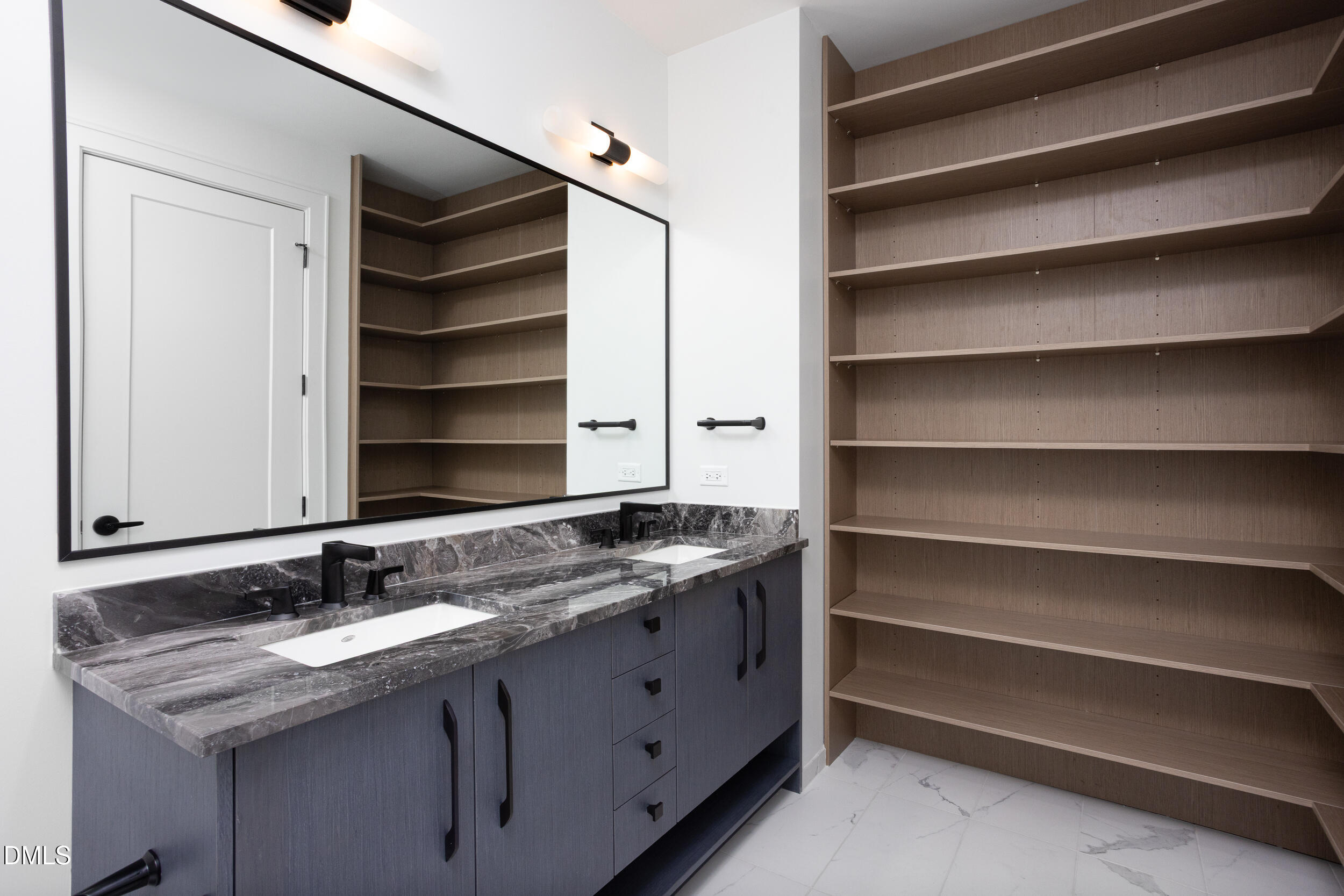 115 West Morris Street, Unit 2007 Durham, NC 27701 - Photo 19 of 30 a bathroom with a granite countertop sink and a mirror