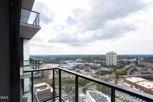 a view of a city skyline from a balcony