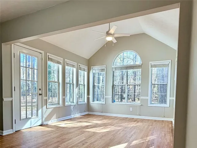 a view of an empty room with a window