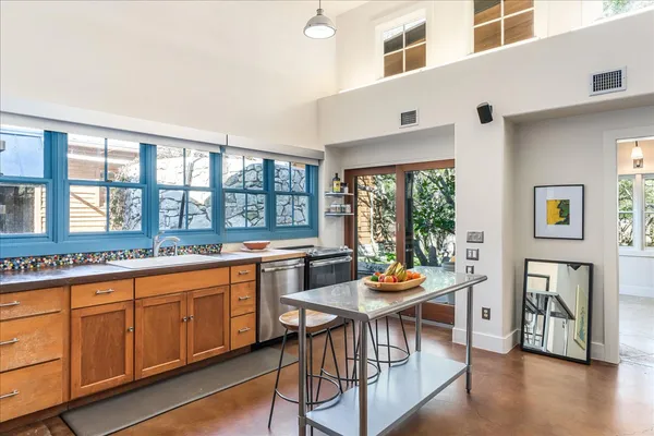 a outdoor dining space with furniture and window