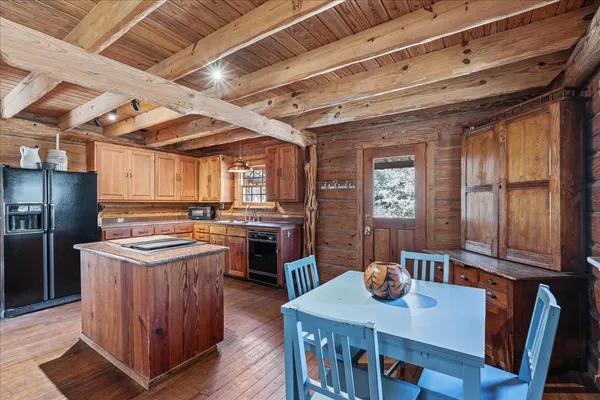 a kitchen with granite countertop lots of counter top space and stainless steel appliances