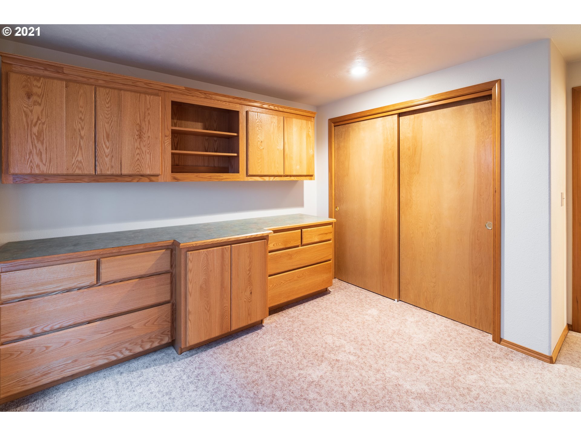 3305 Falcon Drive Springfield, OR 97477 - Photo 13 of 26 a view of a room with cabinet mirror and a wooden floor