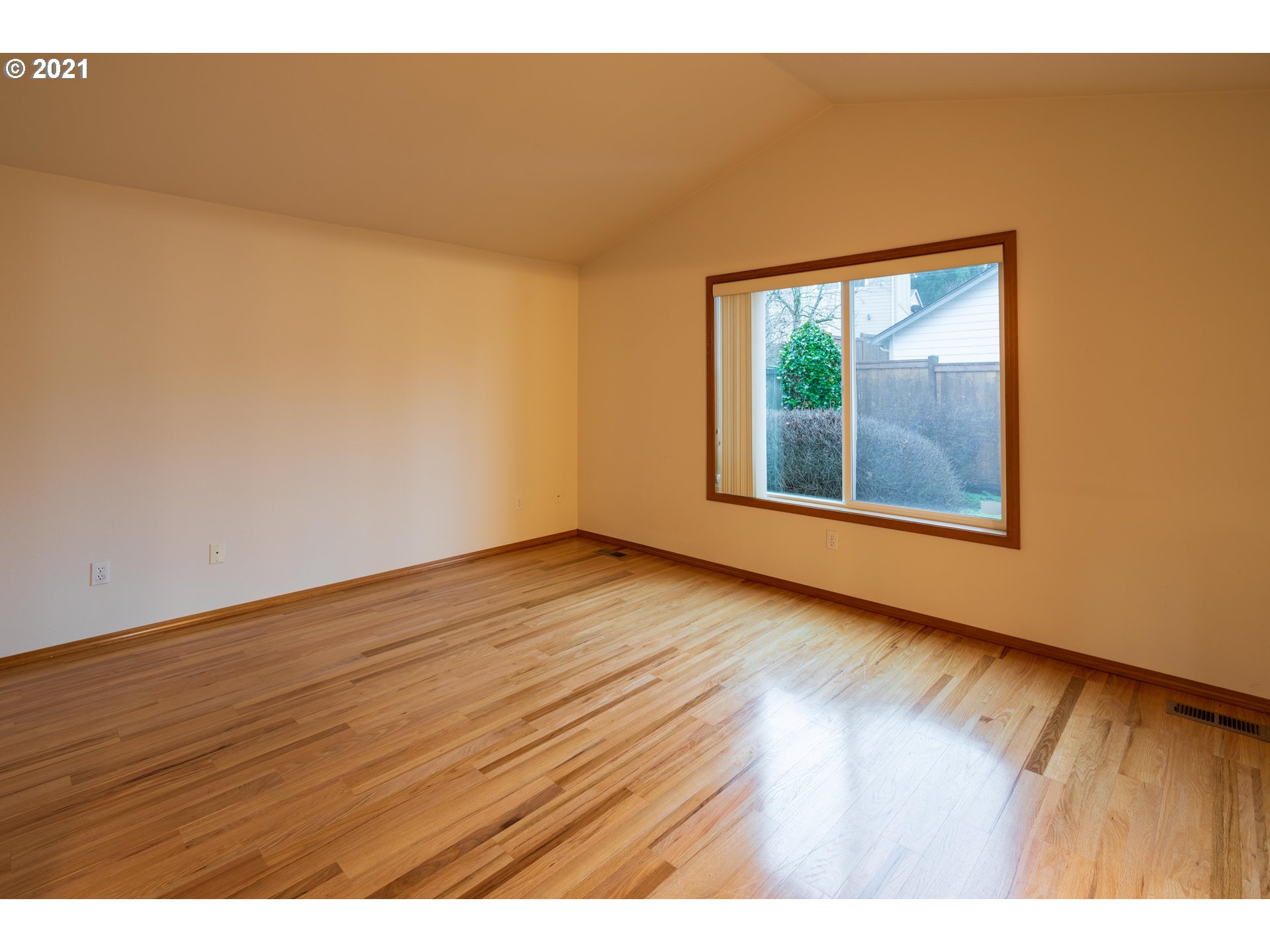 3305 Falcon Drive Springfield, OR 97477 - Photo 17 of 26 a view of an empty room with wooden floor and a window