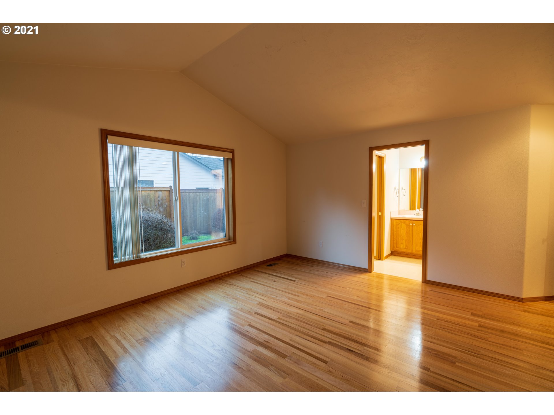 3305 Falcon Drive Springfield, OR 97477 - Photo 18 of 26 a view of an empty room with wooden floor and a window