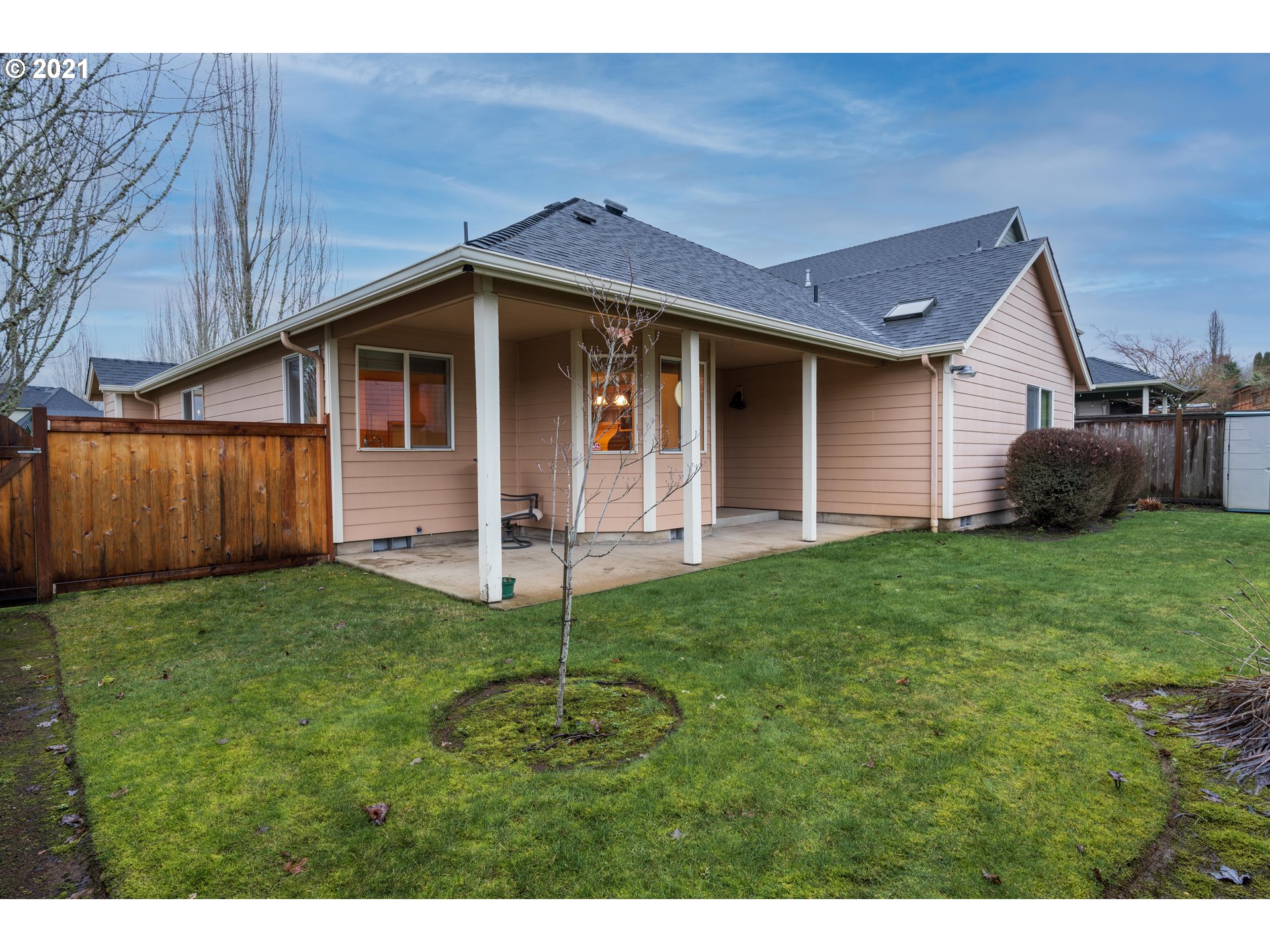 3305 Falcon Drive Springfield, OR 97477 - Photo 24 of 26 a view of a yard in front of a house with plants and wooden fence