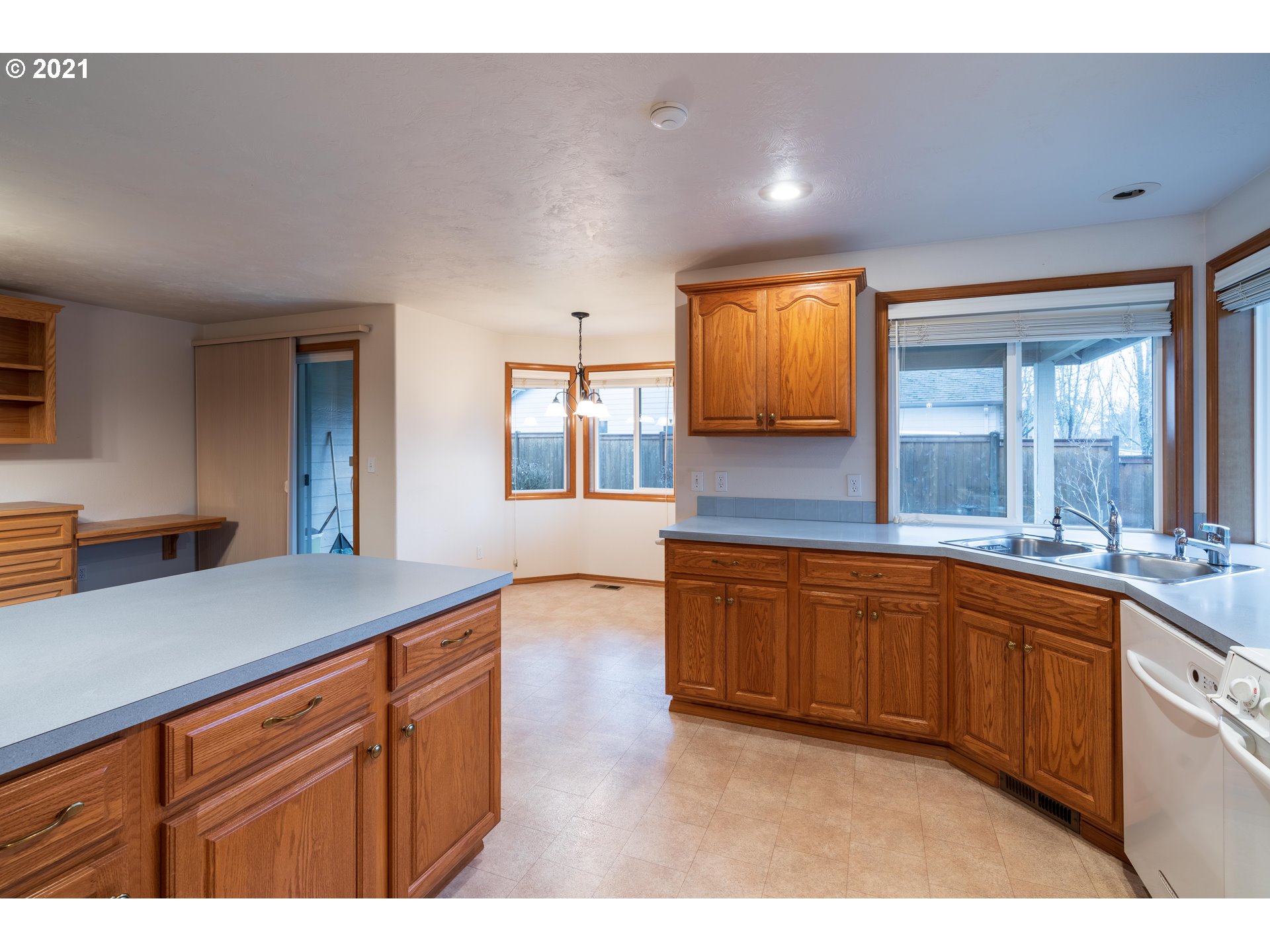 3305 Falcon Drive Springfield, OR 97477 - Photo 9 of 26 a kitchen with granite countertop sink and cabinets