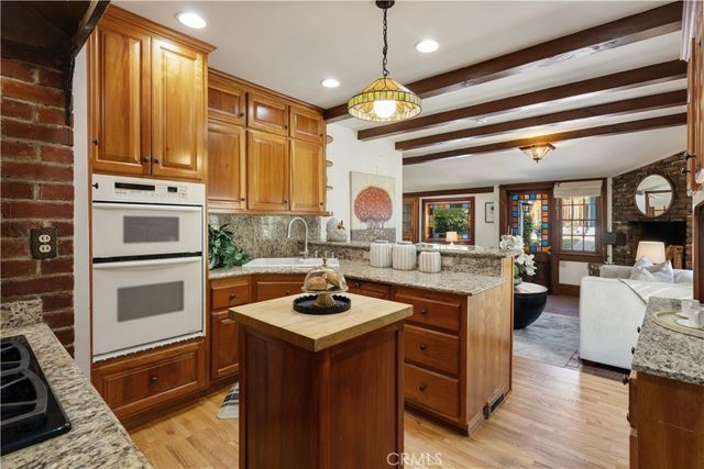 a kitchen with a stove and a refrigerator