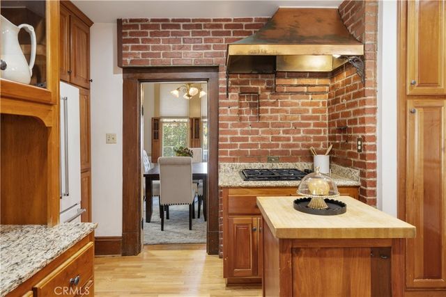 a living room with furniture a rug and a large window