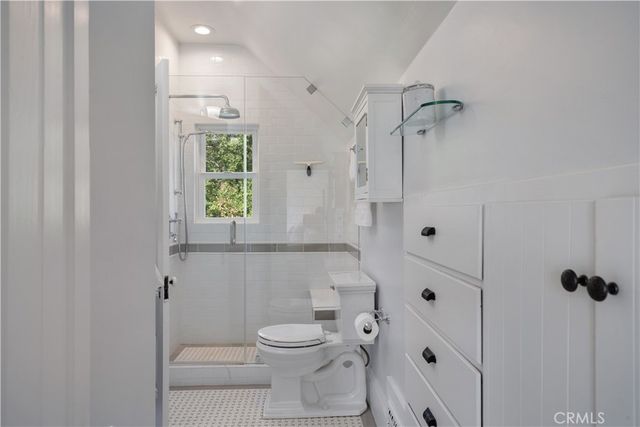 a view of a chairs and table under an umbrella