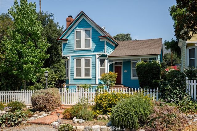 a view of a wooden house with a outdoor space